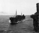 Housatonic (AO-35) approaches Ranger (CV-4) enroute to North Africa during Operation TORCH. (National Archives)