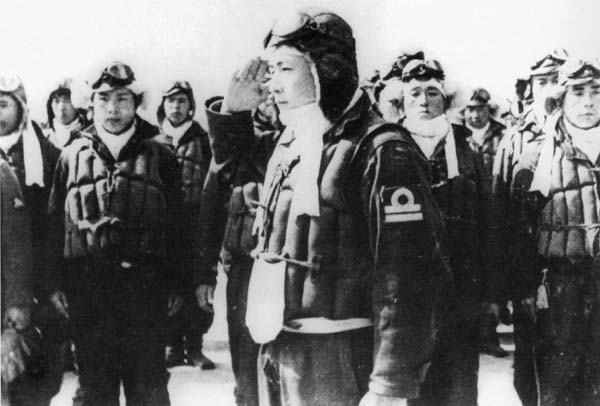 Kamikaze pilot salutes on receiving his orders.