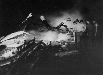 Crewmen fight fires on the flight deck of Randolph (CV 15)